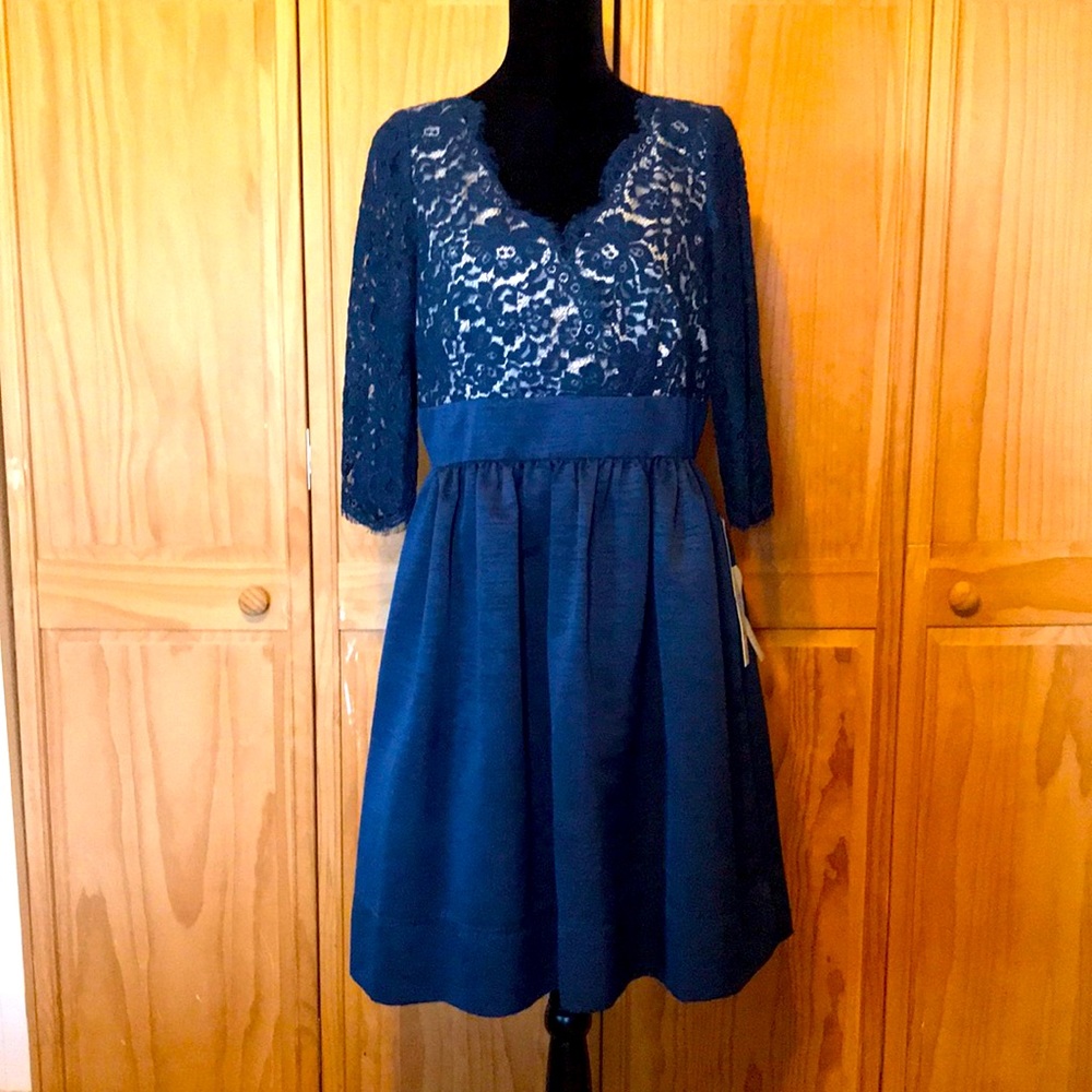Formal dress in navy blue with lace top over beige. Size 14. New with tags.